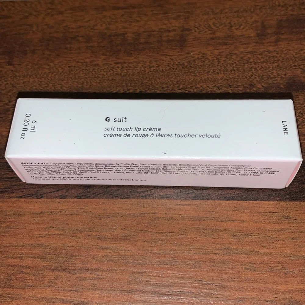 glossier suit